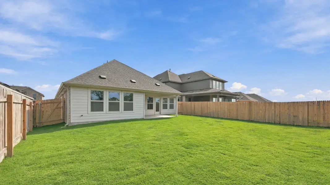 Exterior details and patio area of a home in Carillon, Manor (Image 23).