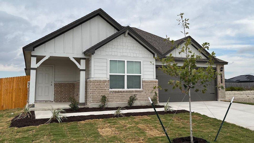 Front exterior of a new home in Eastern Wells, Jarrell, TX, highlighting curb appeal (Image 16).