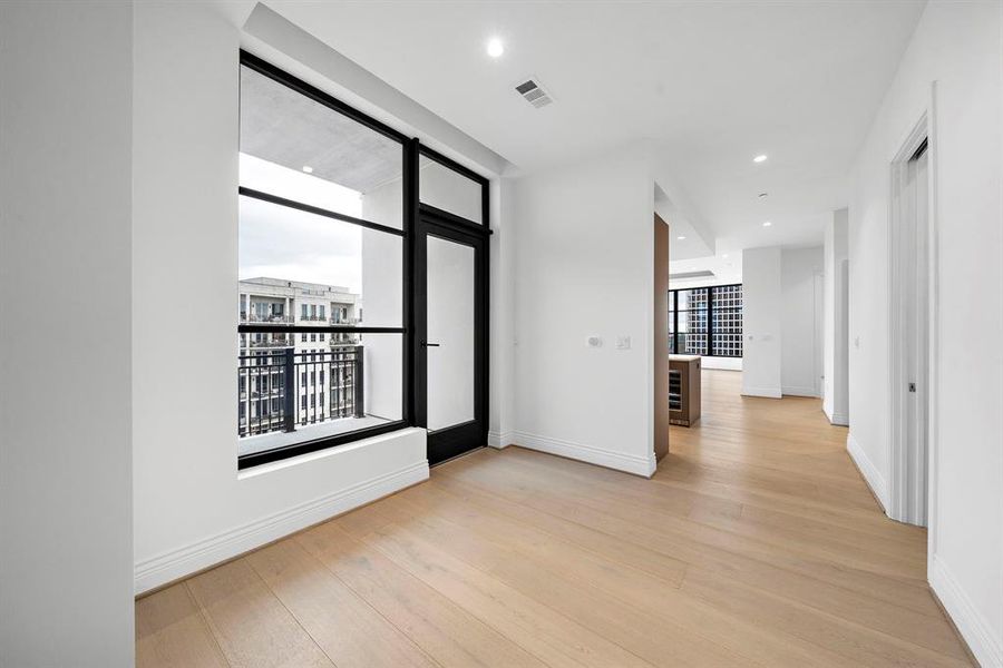 Foyer off private elevator combines modern design & with classic luxury. The hallway seamlessly transitions into the heart of the home.