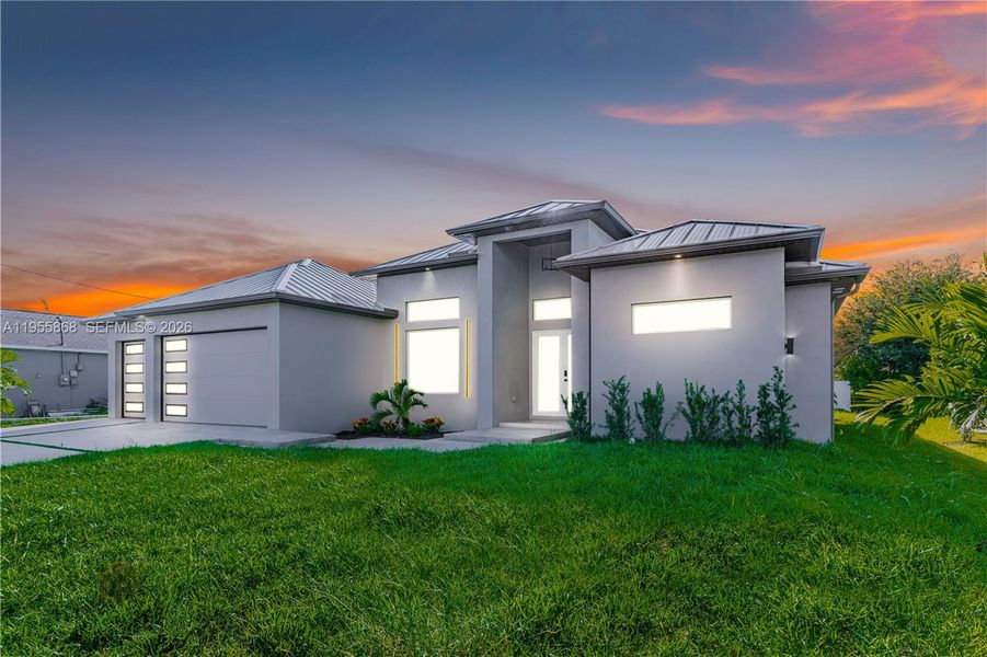 Front exterior of a new home in , Cape Coral, FL, highlighting curb appeal (Image 24). Front exterior of a new home in , Cape Coral, FL, highlighting curb appeal (Image 24).