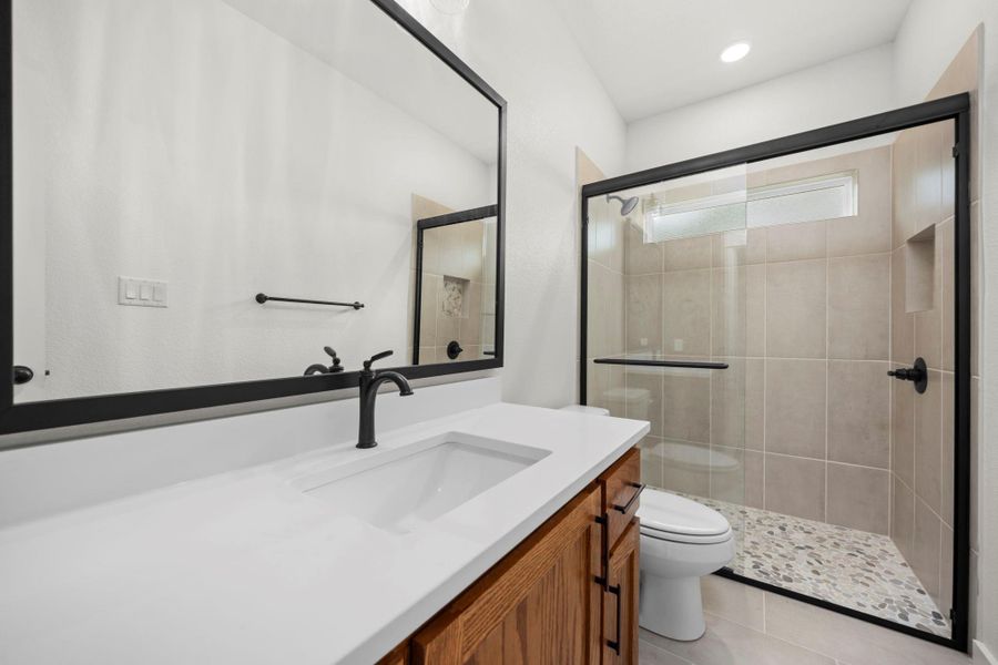 A well-appointed bathroom with a modern vanity, spacious shower, and elegant finishes. A well-appointed bathroom with a modern vanity, spacious shower, and elegant finishes.