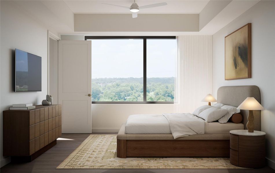 Bedroom showcasing soft natural light, wood flooring, and warm neutral finishes. Features a picture window with vista and treetop views, creating a serene, well-balanced retreat. Bedroom showcasing soft natural light, wood flooring, and warm neutral finishes. Features a picture window with vista and treetop views, creating a serene, well-balanced retreat.