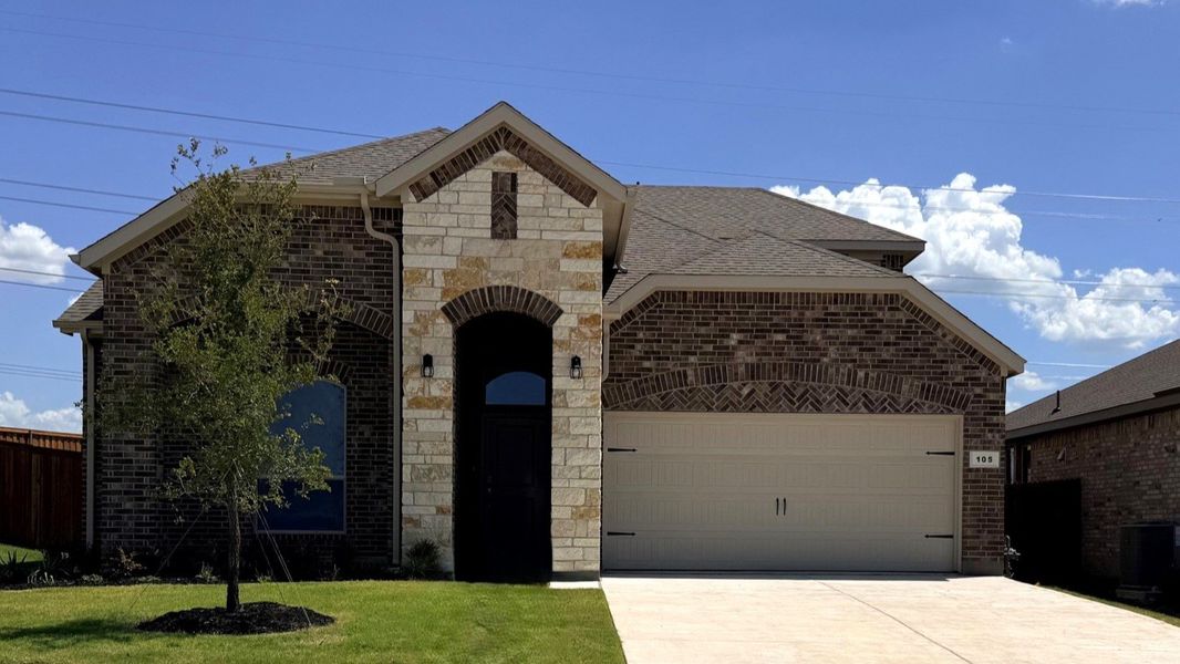 Front exterior of a new home in Bluestem, Rhome, TX, highlighting curb appeal (Image 1). Front exterior of a new home in Bluestem, Rhome, TX, highlighting curb appeal (Image 1).