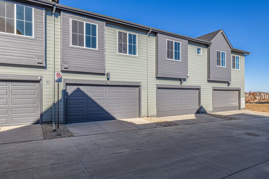 Front exterior of a new home in Arras Park, Thornton, CO, highlighting curb appeal (Image 21).