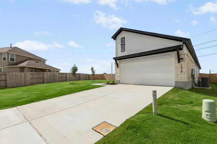 Front exterior of a new home in Willowbrook, New Braunfels, TX, highlighting curb appeal (Image 16). Front exterior of a new home in Willowbrook, New Braunfels, TX, highlighting curb appeal (Image 16).