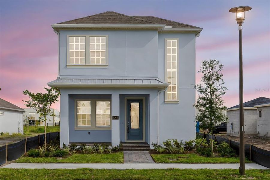 Front exterior of a new home in Laureate Park, Orlando, FL, highlighting curb appeal (Image 1). Front exterior of a new home in Laureate Park, Orlando, FL, highlighting curb appeal (Image 1).