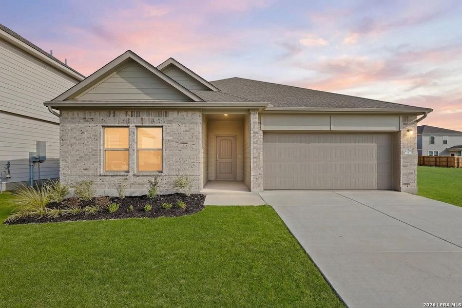 Front exterior of a new home in Summerlin, Castroville, TX, highlighting curb appeal (Image 22). Front exterior of a new home in Summerlin, Castroville, TX, highlighting curb appeal (Image 22).