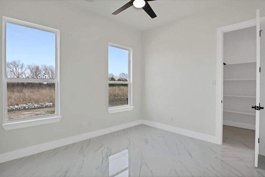 Unfurnished room with ceiling fan