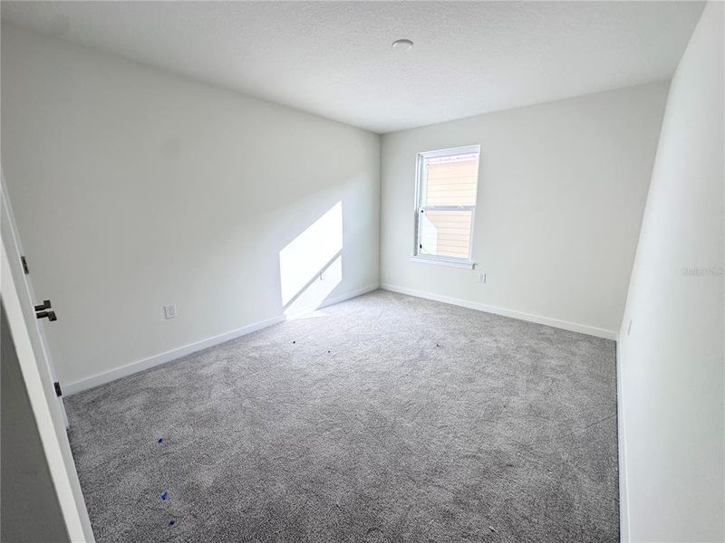 Spacious, unfurnished interior of a new home in Grasslands West, Lakeland (Image 33).