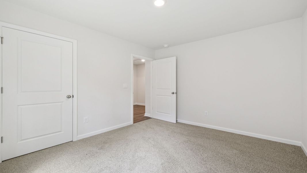 Spacious, unfurnished interior of a new home in Bentley Park, Greenwood (Image 17).
