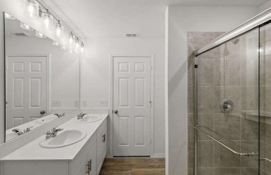 Spacious owner's bath with dual vanity *real home pictured