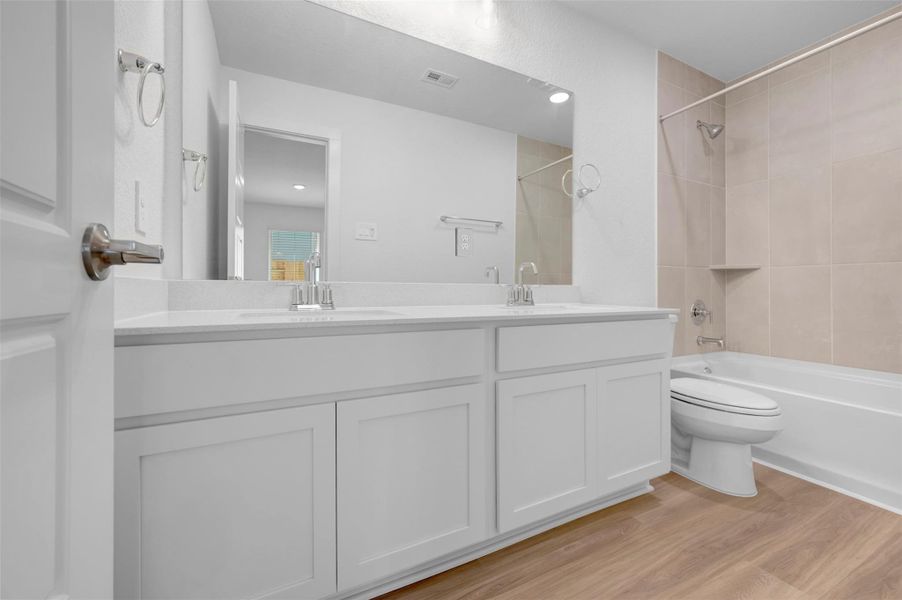 Furnished interior view inside a new home in Lone Star Landing, Montgomery (Image 9).