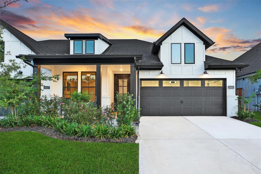 Front exterior of a new home in The Highlands: Highland Duets, Porter, TX, highlighting curb appeal (Image 1). Front exterior of a new home in The Highlands: Highland Duets, Porter, TX, highlighting curb appeal (Image 1).