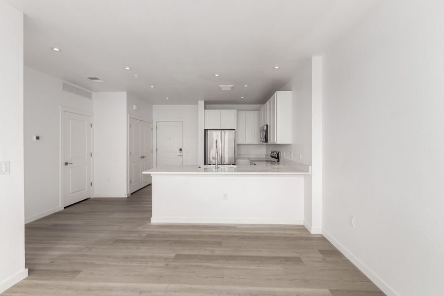 Spacious, unfurnished interior of a new home in The Scene at Sloan's Lake, Denver (Image 7).