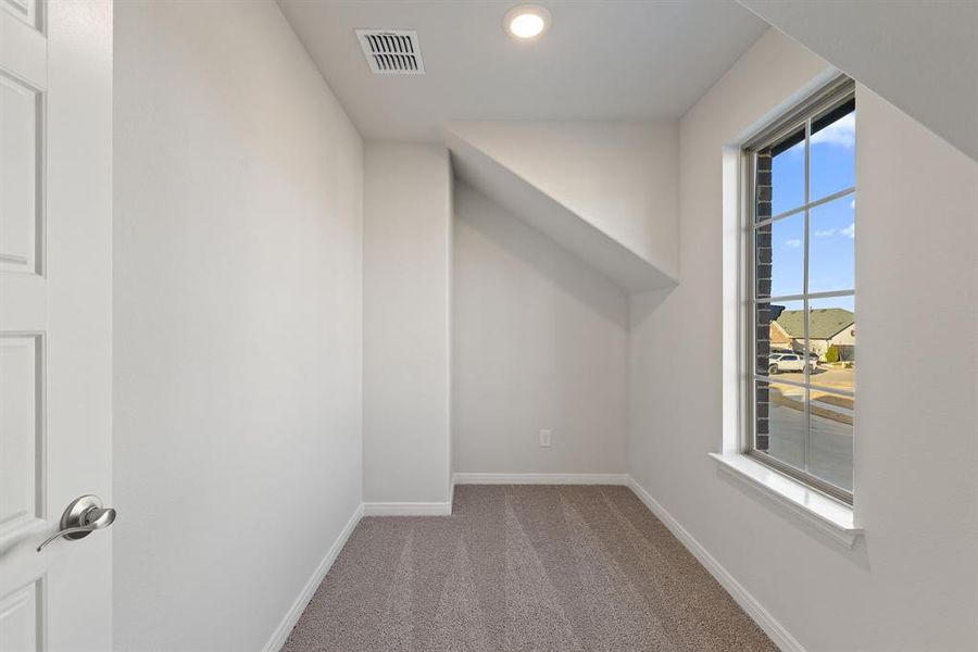 Upstairs you'll find a wonderful storage space with window adding natural light.