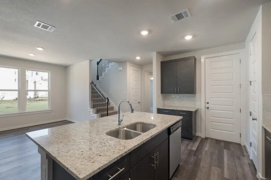 Representative furnished interior of a home built from the Pleasanton by Scott Felder Homes in Flora, Hutto (Image 6).