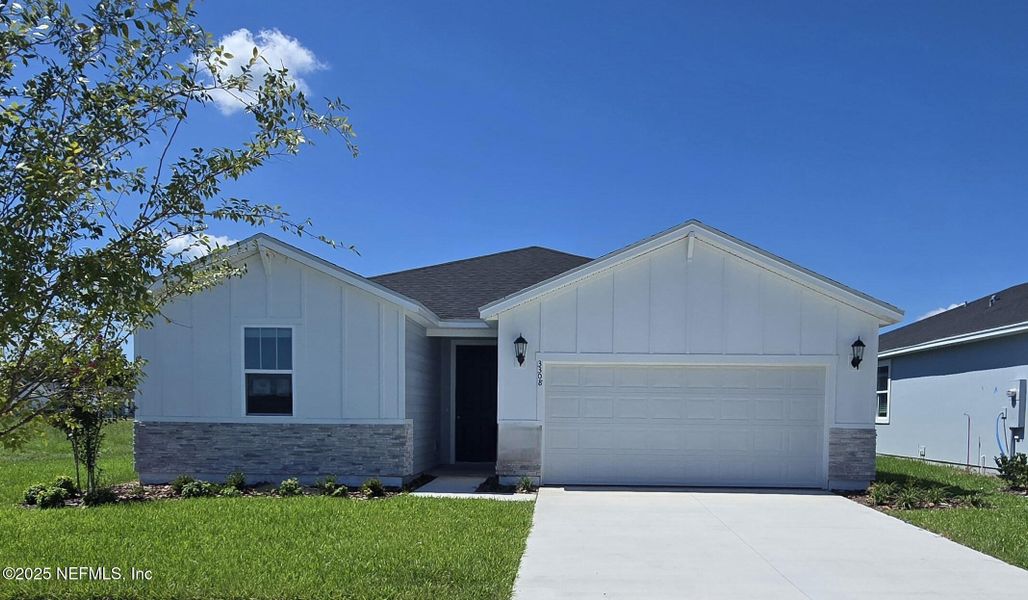 Front exterior of a new home in Lakes at Bella Lago - Signature Series, Green Cove Springs, FL, highlighting curb appeal (Image 17).