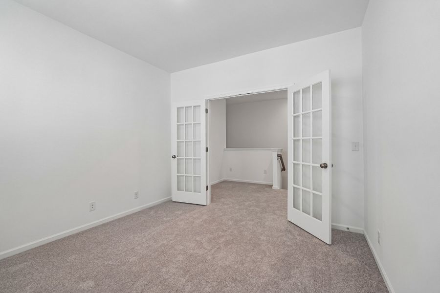 Spacious, unfurnished interior of a new home in Terraces at the Exchange, Indian Land (Image 38).