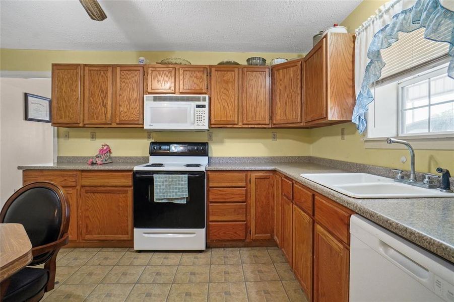 Wood Cabinets, Range, Built In Microwave, Dishwasher Appliances that are included