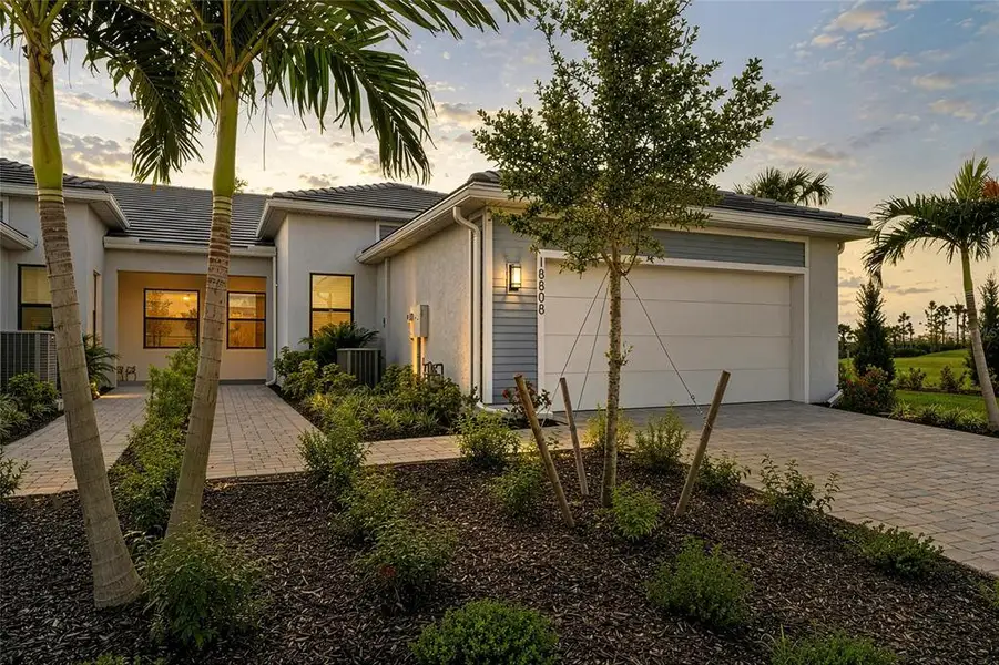Front exterior of a new home in , Lakewood Ranch, FL, highlighting curb appeal (Image 26). Front exterior of a new home in , Lakewood Ranch, FL, highlighting curb appeal (Image 26).