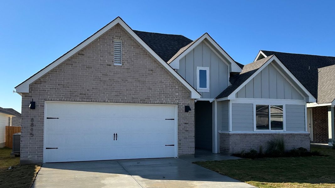Front exterior of a new home in Mesa Ridge, Temple, TX, highlighting curb appeal (Image 12).