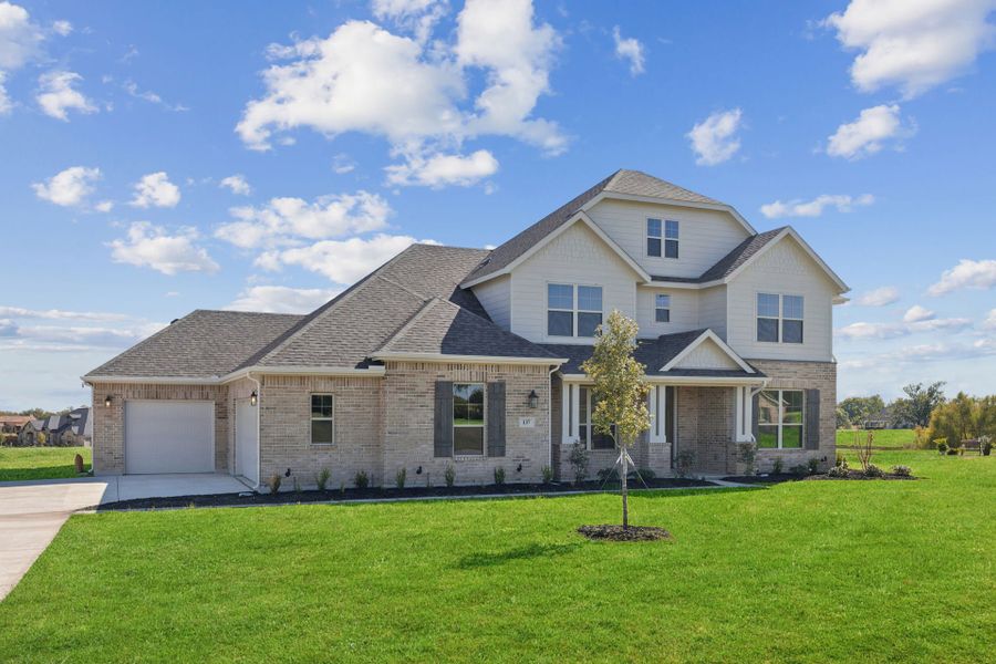 Front exterior of a new home in Lakeway Estates, Waxahachie, TX, highlighting curb appeal (Image 2). Front exterior of a new home in Lakeway Estates, Waxahachie, TX, highlighting curb appeal (Image 2).