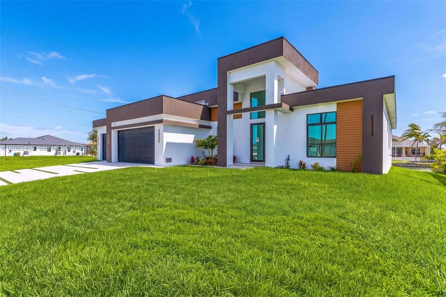 Front exterior of a new home in , Cape Coral, FL, highlighting curb appeal (Image 20).