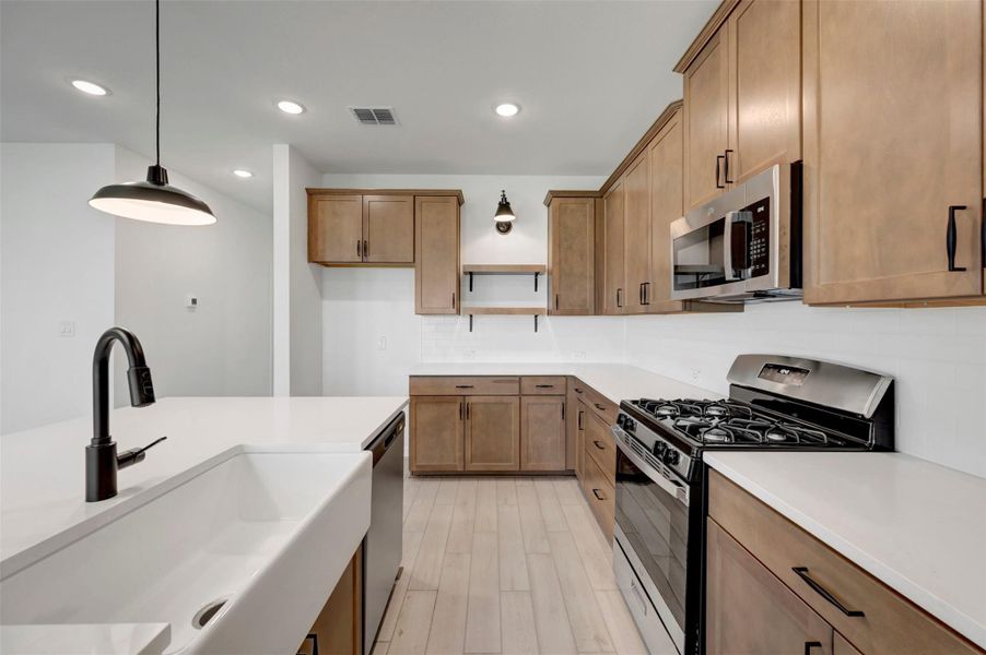 Stylish kitchen with chestnut brown cabinets