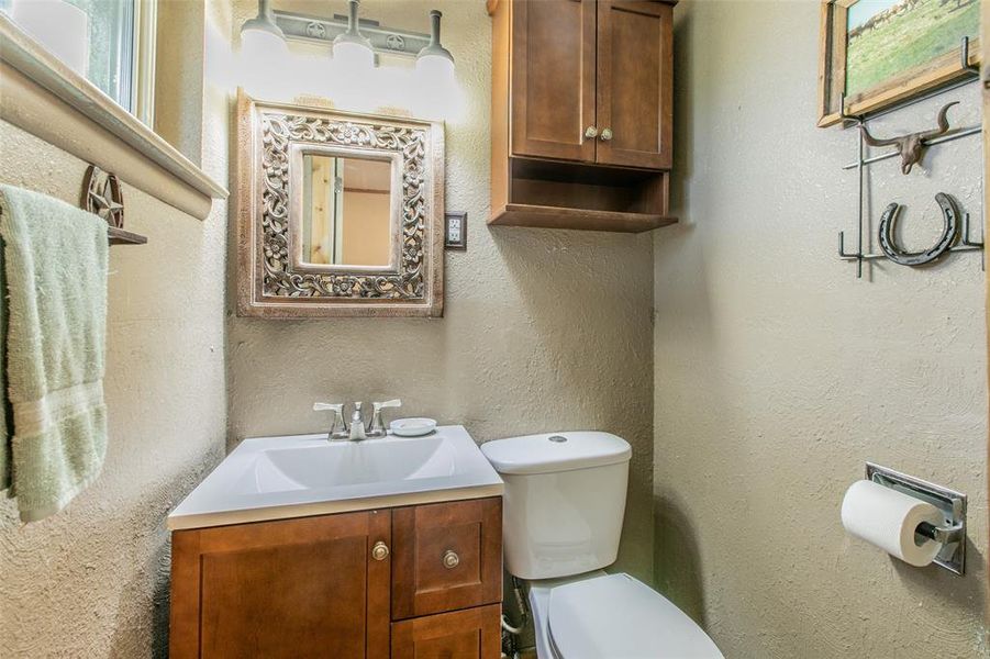 Private half bath in primary bedroom. Private half bath in primary bedroom.