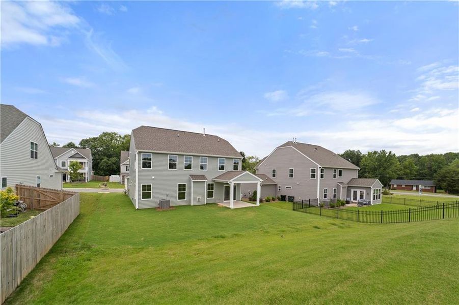 Exterior details and patio area of a home in Twin Lakes, Hoschton (Image 17).