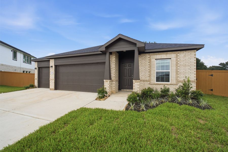 Front exterior of a new home in Cypress Green, Hockley, TX, highlighting curb appeal (Image 2). Front exterior of a new home in Cypress Green, Hockley, TX, highlighting curb appeal (Image 2).