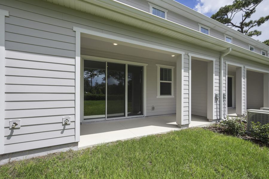 Exterior details and patio area of a home in Towns at Riverwalk, Sanford (Image 1). Exterior details and patio area of a home in Towns at Riverwalk, Sanford (Image 1).