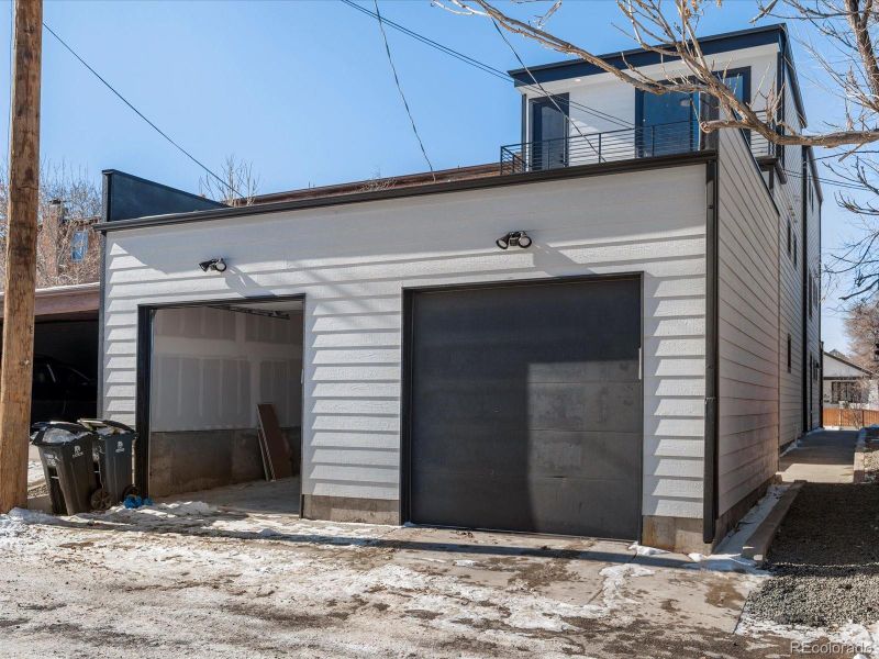 Open garage bay is the deeded garage for Unit #2