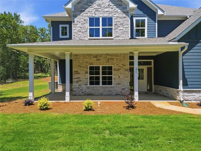 Exterior details and patio area of a home in , White (Image 3).