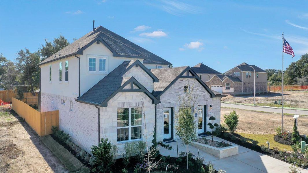 Front exterior of a new home in Rosenbusch Ranch, Leander, TX, highlighting curb appeal (Image 19).