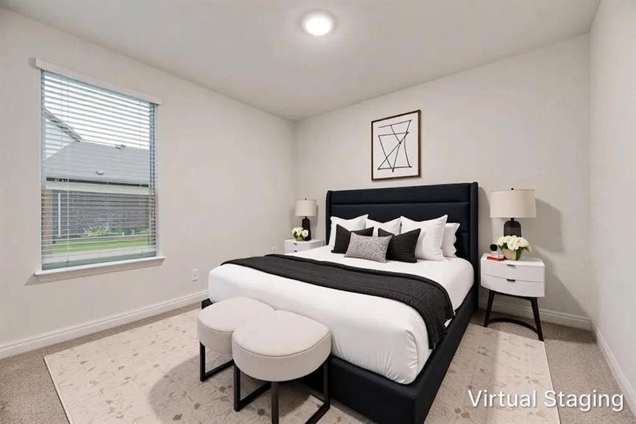 Carpeted bedroom featuring a large window with blinds, base molding, and a flush-mount ceiling light