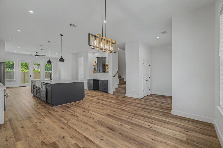 Spacious flex room perfect for a home office or home bar, conveniently located off the kitchen and dining area.