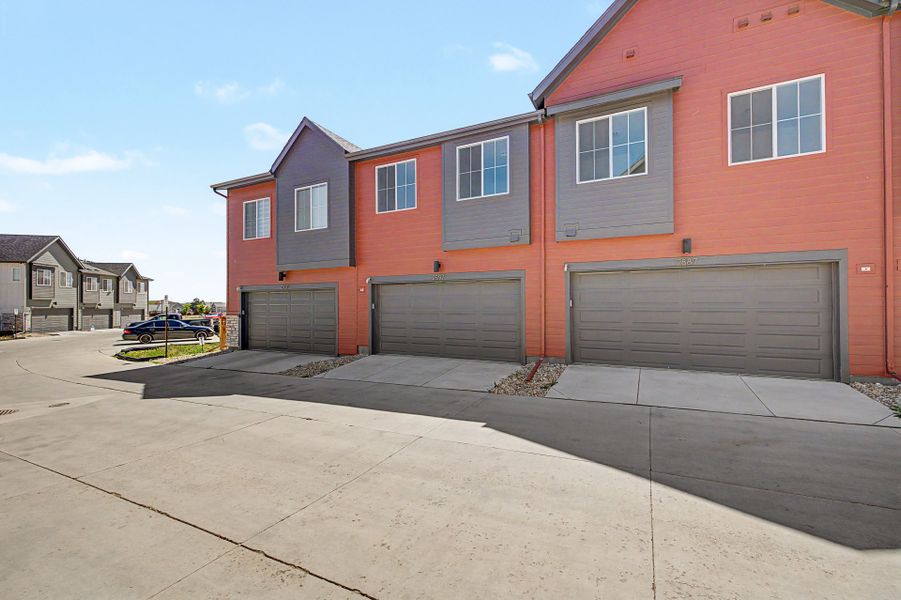 Front exterior of a new home in Arras Park, Thornton, CO, highlighting curb appeal (Image 16).