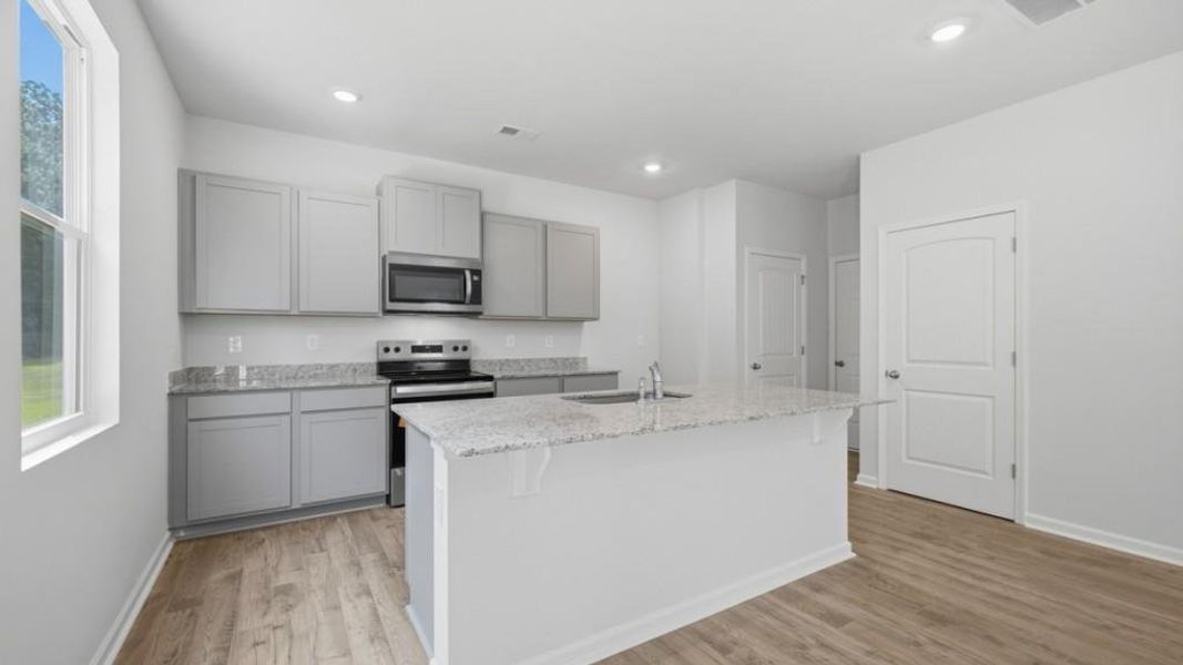 Furnished interior view inside a new home in Oaks at Cedar Grove, Fairburn (Image 7).