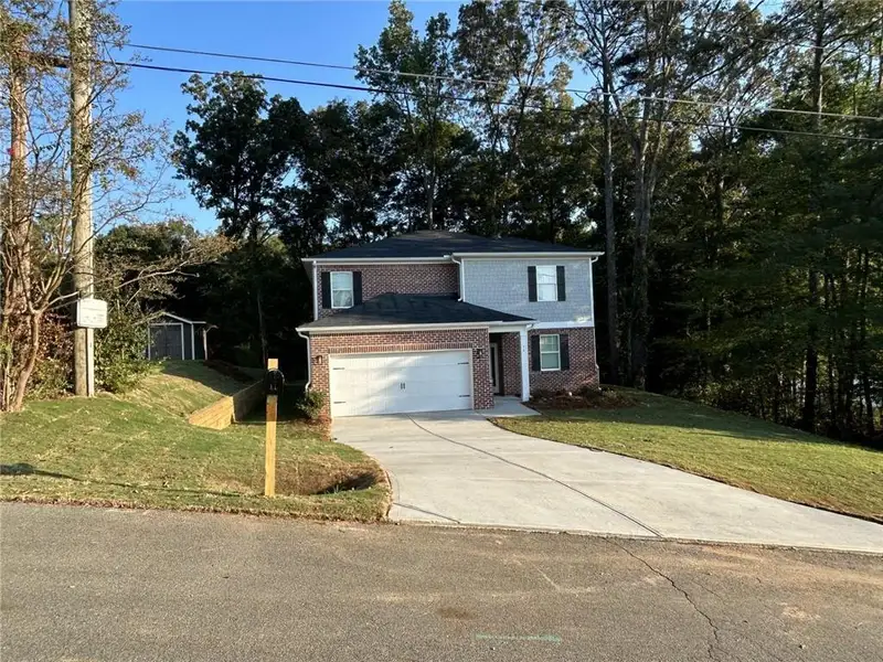 Front exterior of a new home in , Cartersville, GA, highlighting curb appeal (Image 15).