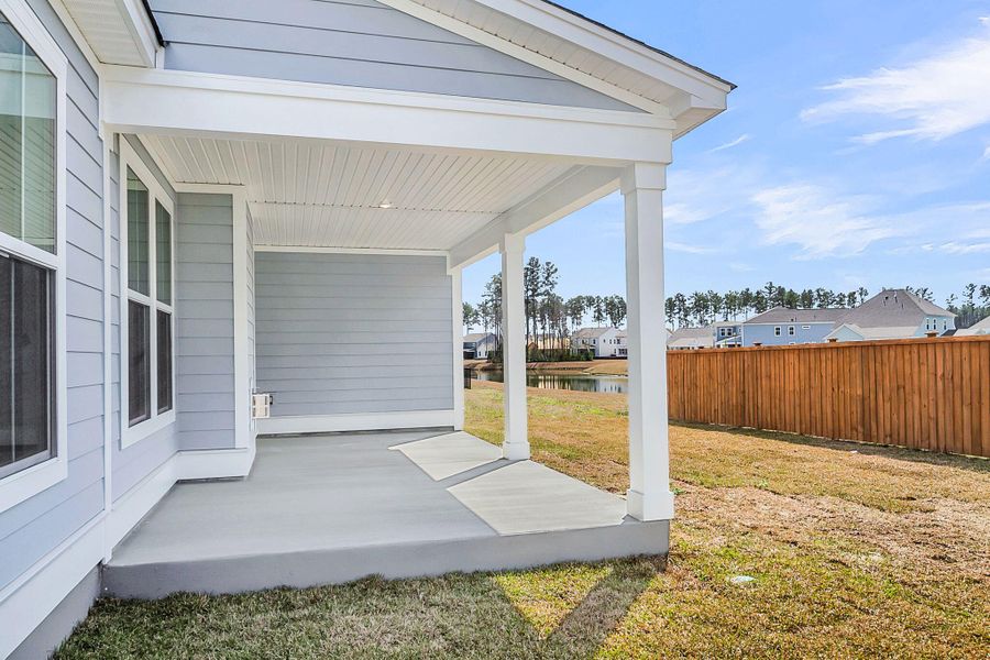 Exterior details and patio area of a home in Tidewater at Lakes of Cane Bay, Summerville (Image 4).
