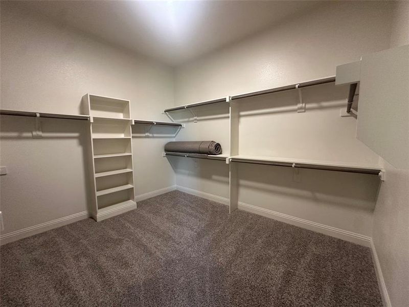 Primary closet connects to utlity