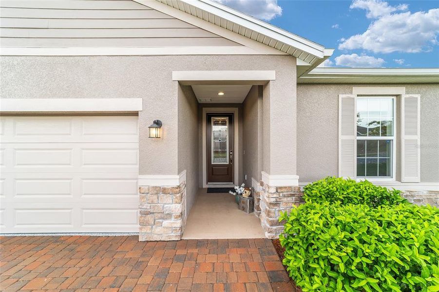 Front exterior of a new home in Ocala Preserve, Ocala, FL, highlighting curb appeal (Image 26).