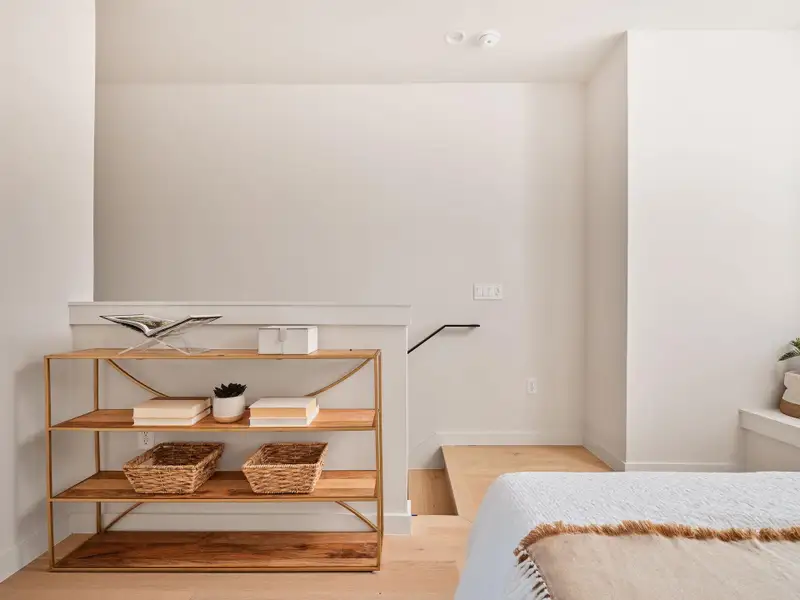 Bedroom with light wood-type flooring and baseboards