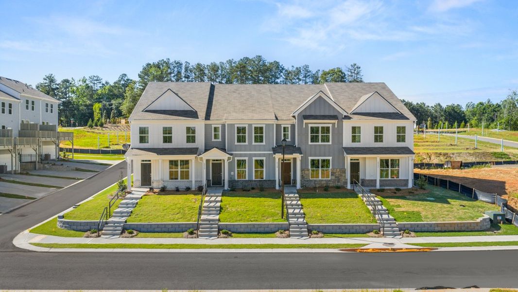 Representative exterior photo of a completed home built from the AMESBURY by D.R. Horton in Waypoint, Flowery Branch, GA (Image 1).