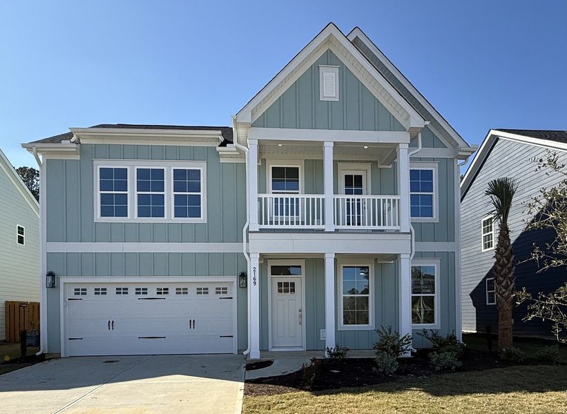 Front exterior of a new home in Grand Park, Leland, NC, highlighting curb appeal (Image 1). Front exterior of a new home in Grand Park, Leland, NC, highlighting curb appeal (Image 1).