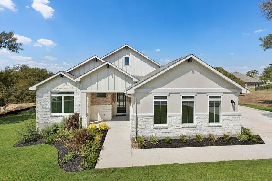 Front exterior of a new home in Double Eagle Ranch, Cedar Creek, TX, highlighting curb appeal (Image 1). Front exterior of a new home in Double Eagle Ranch, Cedar Creek, TX, highlighting curb appeal (Image 1).