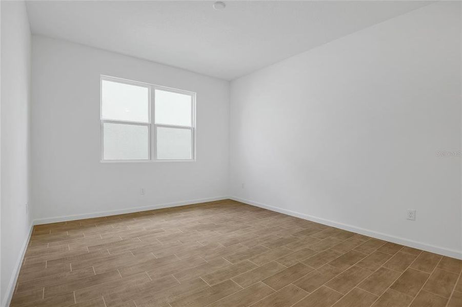 Spacious, unfurnished interior of a new home in Seasons at Grandview Gardens, Deland (Image 13).