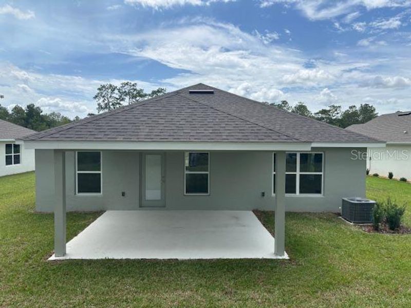 Front exterior of a new home in Juliette Falls, Dunnellon, FL, highlighting curb appeal (Image 7). Front exterior of a new home in Juliette Falls, Dunnellon, FL, highlighting curb appeal (Image 7).