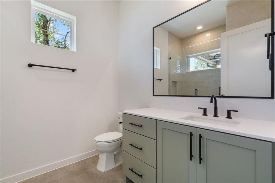 Bathroom with vanity and a shower stall